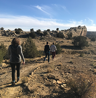 students walking on trail outdoors