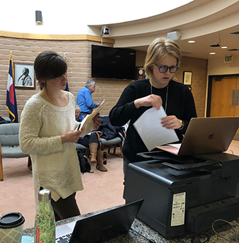 students working on wills at computer