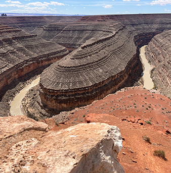 river carves a path through a canyon